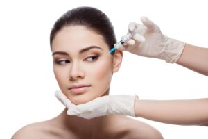 Attractive woman in late 20s tries preventative Botox to delay the formation of wrinkles near her eyes